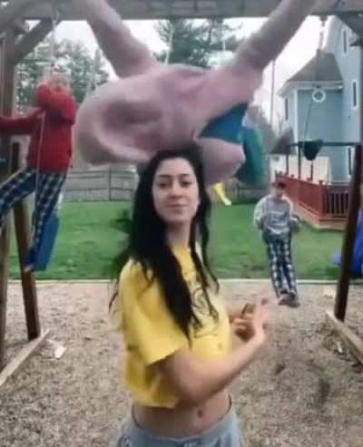 To make a TikTok in front of swinging kids