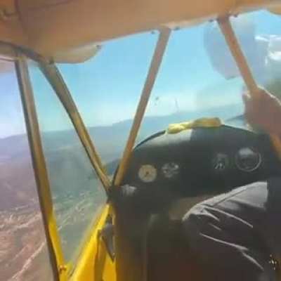 hand starting a plane mid air