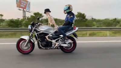 skeleton riding a motorcycle in public roads