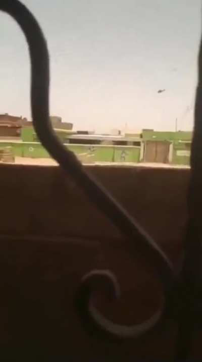Sudanese attack helicopter firing at RSF positions on the ground after clashes broke out between two government factions