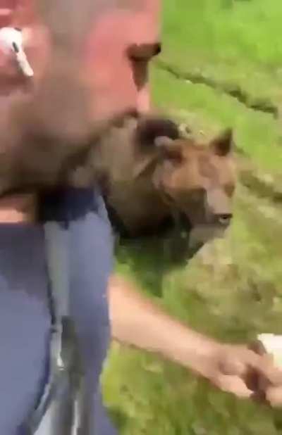 Guy being chased by a bear.