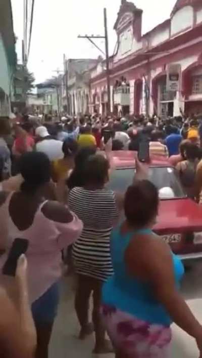 Protestors in front of the Cuban Communist Party Headquarters chanting 
