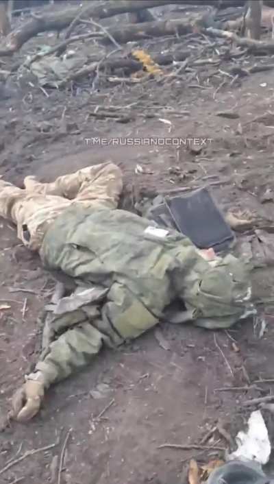 Russian soldier showing the death and destruction of their position