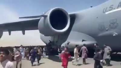 Escape from Kabul. Afghans fleeing Taliban militants hoping to leave the country - tied themselves with ropes to the plane.