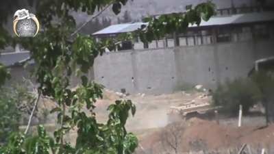 FSA sniper takes a shot at the commander/gunner of a passing Syrian Army BMP-1 in Daraya - 5/3/2014