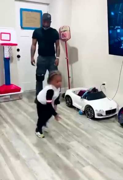 Dad Blocks toddler from shooting a basket and toddler isn’t having any of it