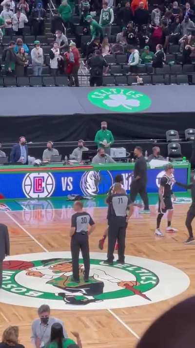 Kyrie Irving stomps on the Celtics logo after the game