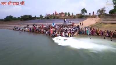 Drone visual - A tanker was parked on the banks of Narmada river, and 11000 litres of milk were offered by 