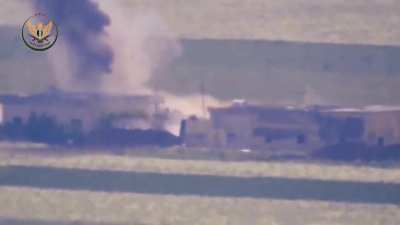 NLF ATGM strike on a Syrian Army tank between two buildings - Tal Hawash - 2019
