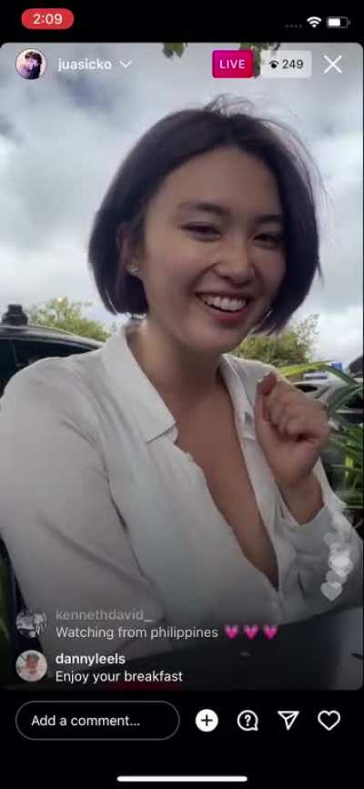 Sheer loose shirt being blown by the wind and revealing bosom. Instagram Live video on February 9, 2022