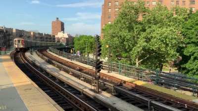 Local -1- train approaching the Dyckman Street station in the Inwood area of Manhattan. (The background noise is from an uptown -1- train which pulled into the station while I was already filming.)