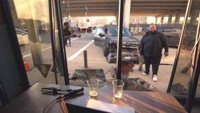 Car smashes through cafe window during podcast session