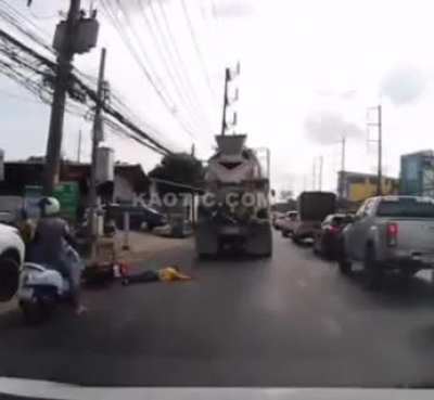 Biker Falls under truck