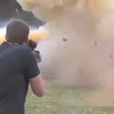 Guys almost gets bisected by the debris of the truck he blew up