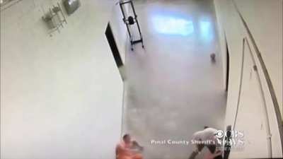 2 inmates decide to sneak attack a jail guard. A fellow guard sees what's happening and drops both inmates with his maglite
