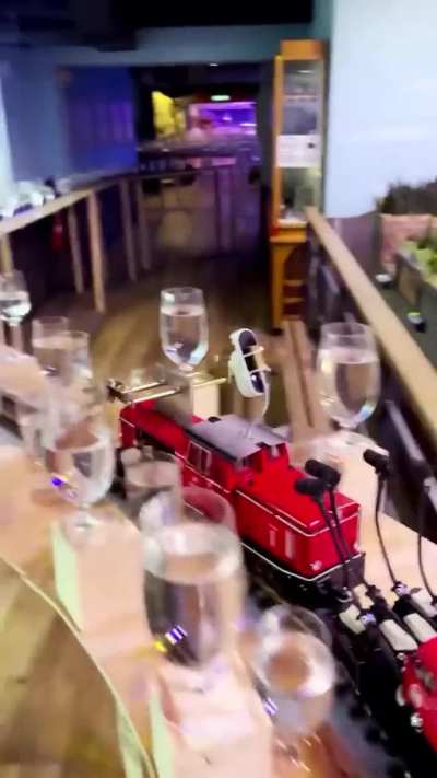 A model train, a couple of spoons, and hundreds of glasses of water combine to play classical music