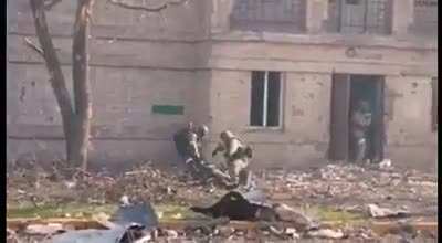 Video of street fighting in the Azovstal area. Russian infantry cross a street, taking fire and a casualty in the process.