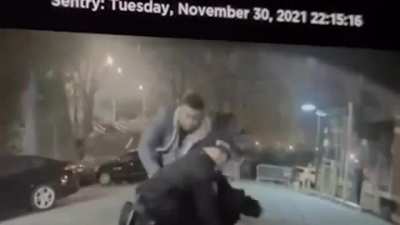 Surveillance Video: Woman causally walks up to police officer and punches him in the face.