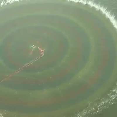 Throwing a fishing net.