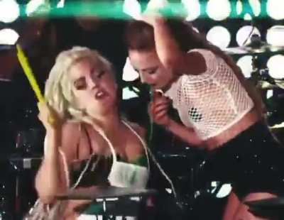 Lady GaGa having a girl vomit on her chest during a performance