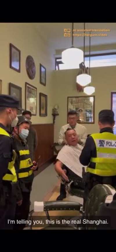 Shanghai Man In Barbershop Lecturing The Police After They Tried Coming In To Shut It Down