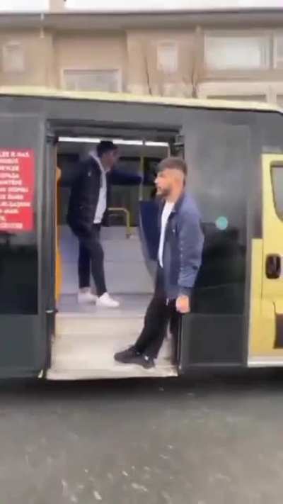 hanging outside a bus