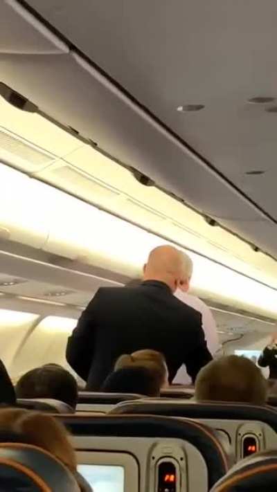Crazy man tries to shake passengers hand