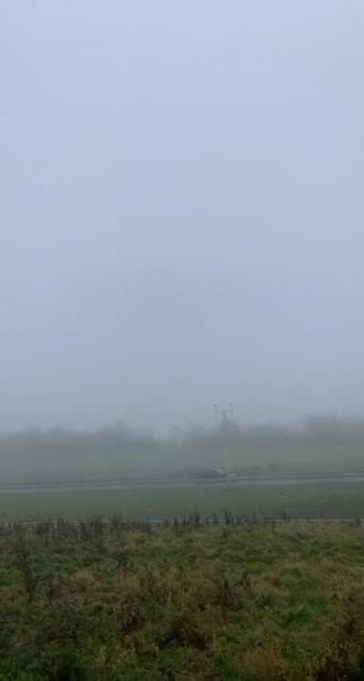 Boeing 747 low fly-by during heavy fog.