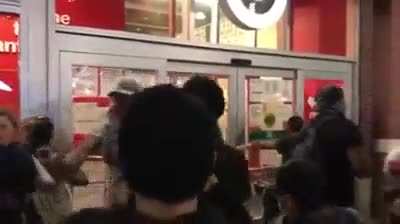 Protestors stop Looters in Brooklyn.
