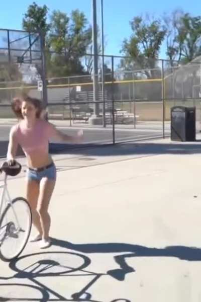 If you look carefully, you'll notice shes riding a bike