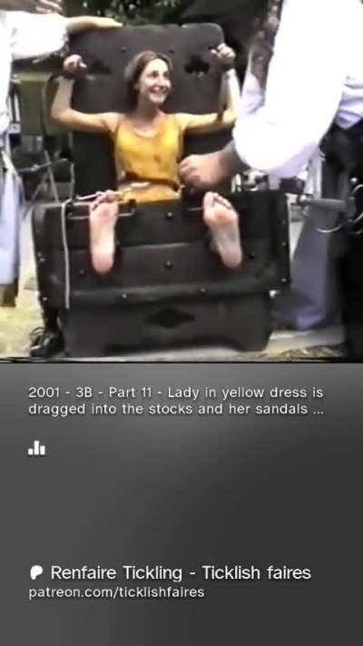 Girl in yellow dress get her toes tied to the stocks and bare soles tickled