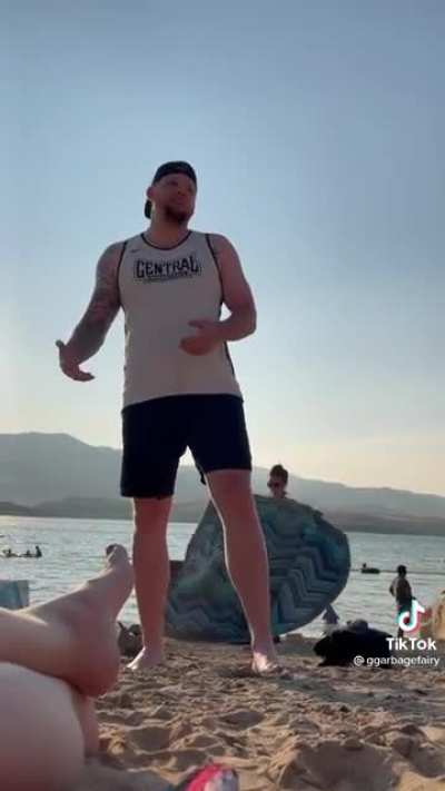 Guy harasses a group of girls at the beach for not dressing modestly.