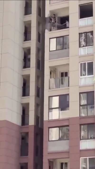 Resident cuts a structural column on the 6th floor of a 20-story building to improve the view