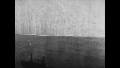 Planes deploying a massive smoke curtain to hide ships. Circa 1920s