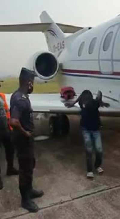 Kid tries to smuggle himself on a jet.
