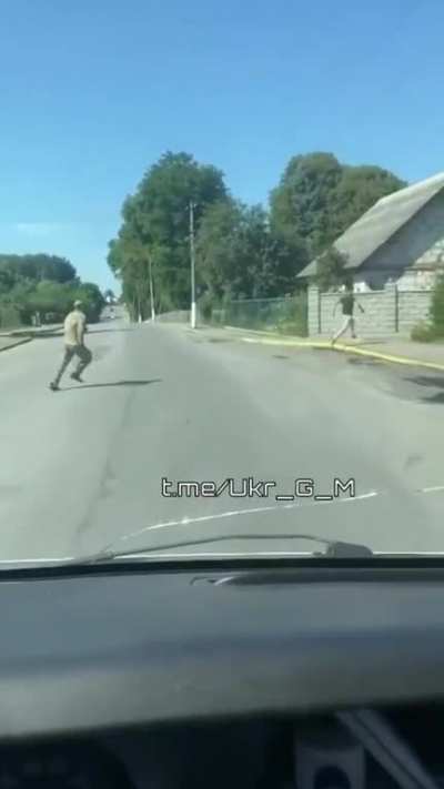 RU POV: Ukrainian civilian male is running away from alleged Ukrainian mobilization officer.