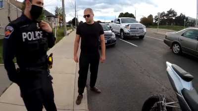 Motorcycle rider pushed to ground by police