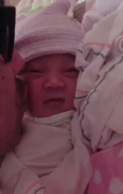 4 hours old and we caught her first “smile” on camera.
