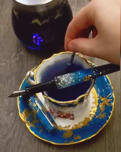 Butterfly Pea Flower tisane with matching aesthetic teacup & Benu fountain pen. Lemon juice makes the color change from blue to purple!