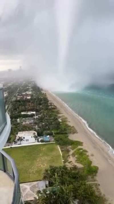Massive waterspout right off the beach in Florida.
