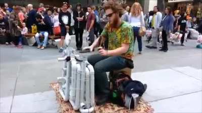 This guy playing a homemade PVC pipe instrument with a pair of flip flops in Adelaide, South Australia.