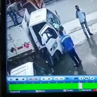 The guy at the top of the truck just saved the life of his friend. If he didn't throw that heavy thing , his friend might get a gunshot.