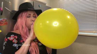 Blowing up a balloon until it pops