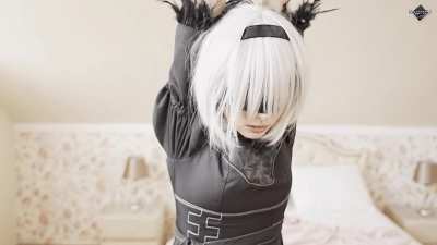 2B from Nier Automata tied up and obediently waiting to be used