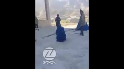 Taliban brutally lashing a woman in Takhar province for going to the shop without a male guardian