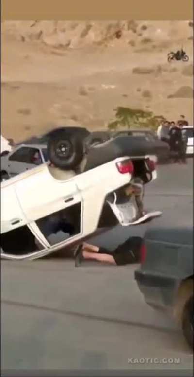 Imbecile sits out of a drifting car’s window and eats pavement. This is rough.
