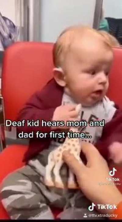 Baby hears parents for first time.