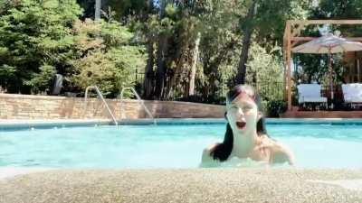 Alexandra Daddario bouncing up from the water (YT GIF)