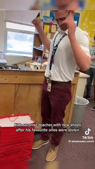 students surprising their teacher with a new pair of shoes, after their favourite ones were stolen