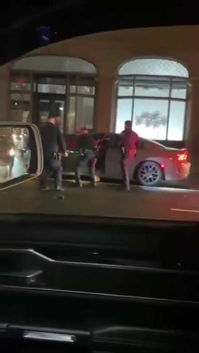 Dude fights off 3 cops at once, then drives off in a car while being tazed